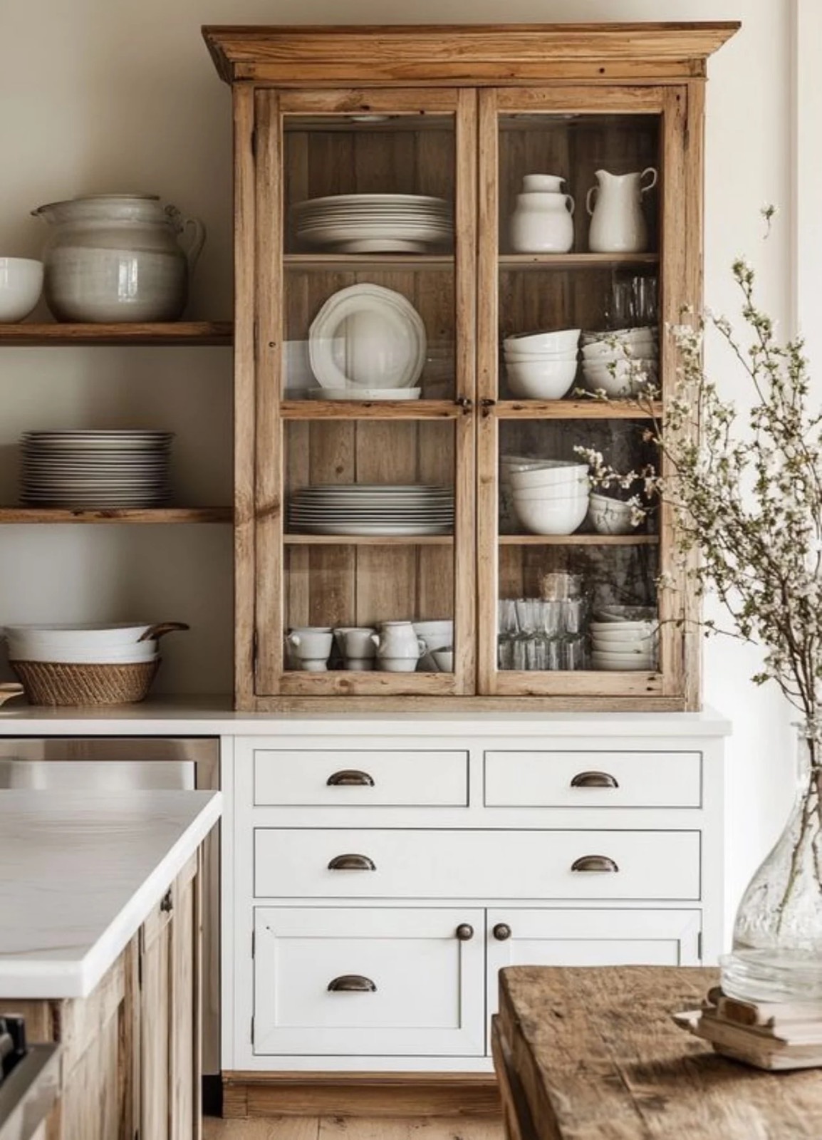 A completed STELLAN interior design project, a kitchen with a reclaimed-wood hutch and white cabinetry