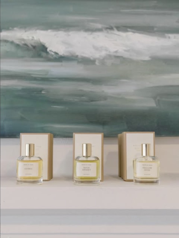Ceramics and fragrance arranged on a shelf